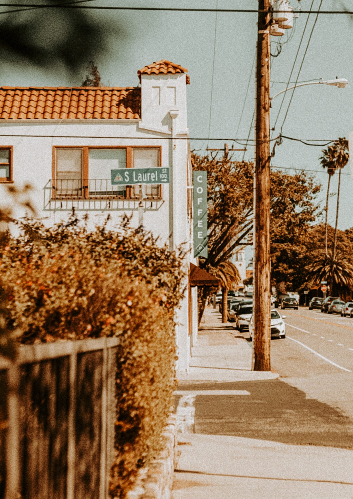 Street corner with a coffee shop sign and a vintage-style building